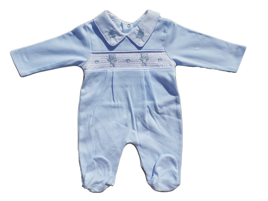 A blue smocked babygrow with a bear and paw pattern, featuring a snap closure at the bottom.