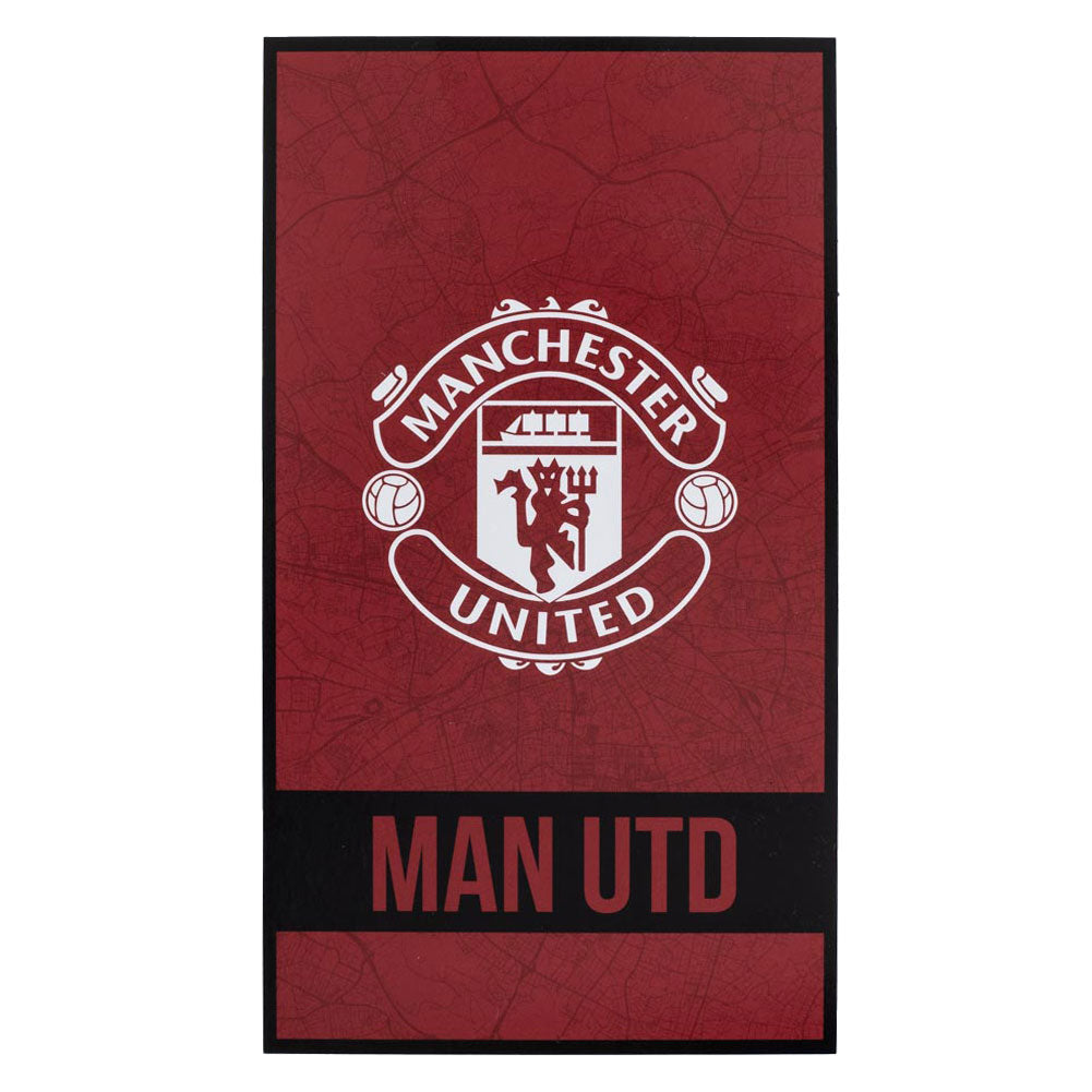 Large soft to touch 100% cotton velour beach towel, Identity design featuring a large club crest in white with red Man Utd text on a black band