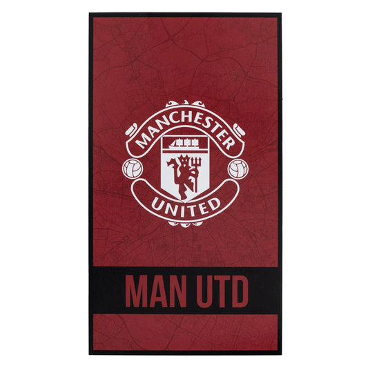 Large soft to touch 100% cotton velour beach towel, Identity design featuring a large club crest in white with red Man Utd text on a black band