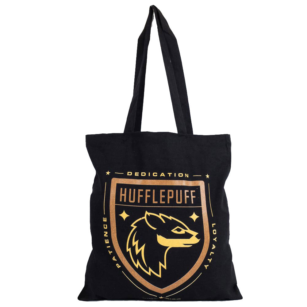 Black canvas tote bag featuring a large gold printed Hufflepuff crest to one side