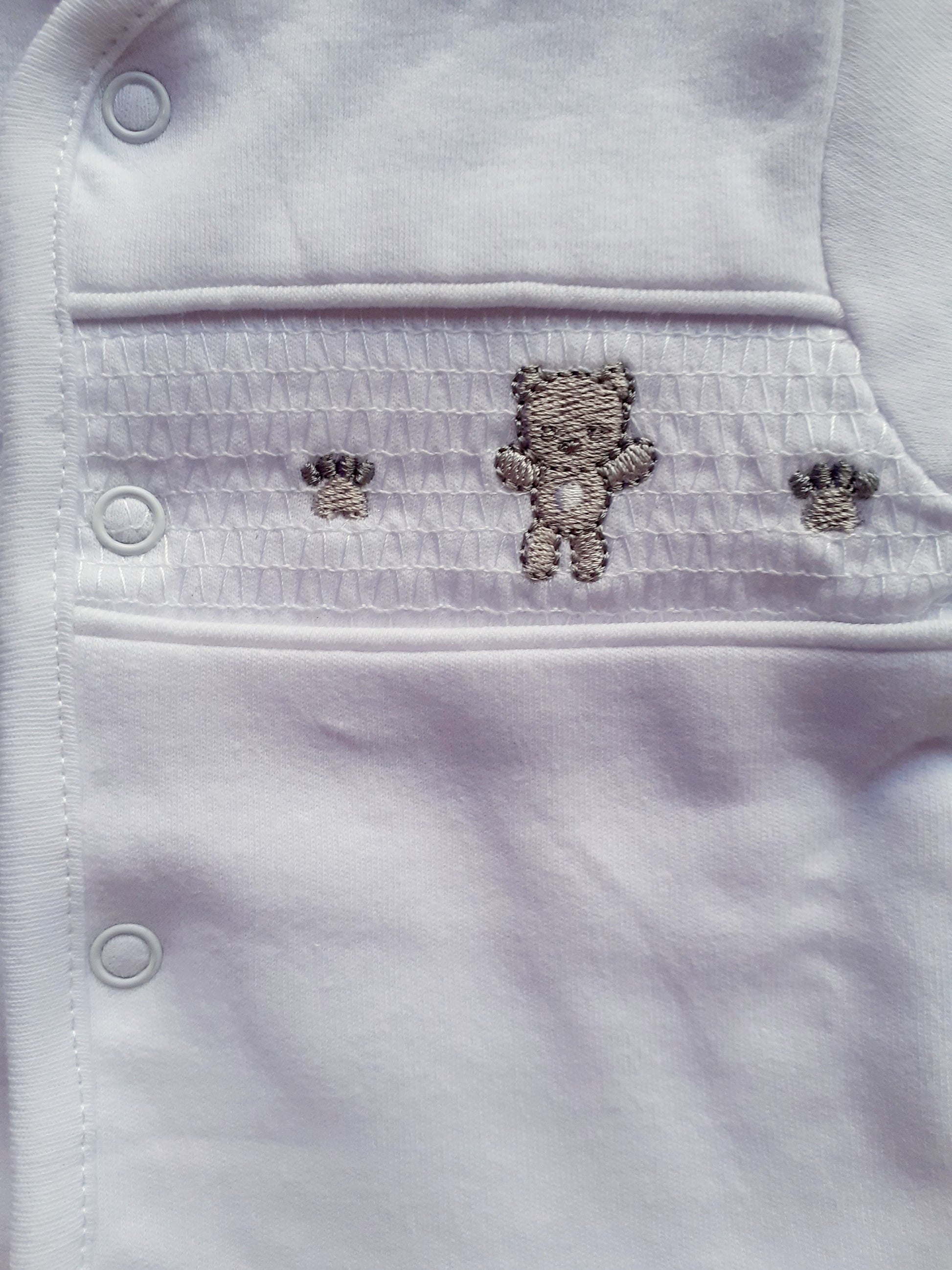 Smocked Bear and paw print motif