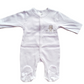 White babygrow with embroidered bear motif