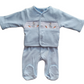 A blue babygrow with a smocked jacket set featuring a bunny design on the sleeves. The set is made of cotton and appears to be soft and breathable.