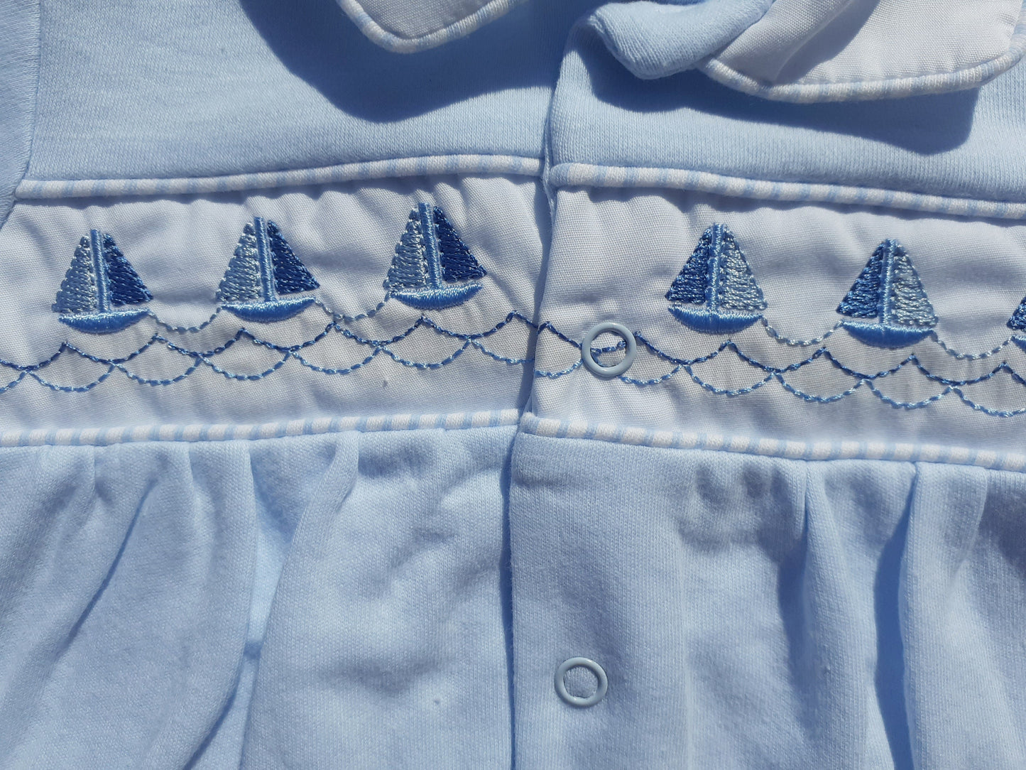 Embroidered blue boat design