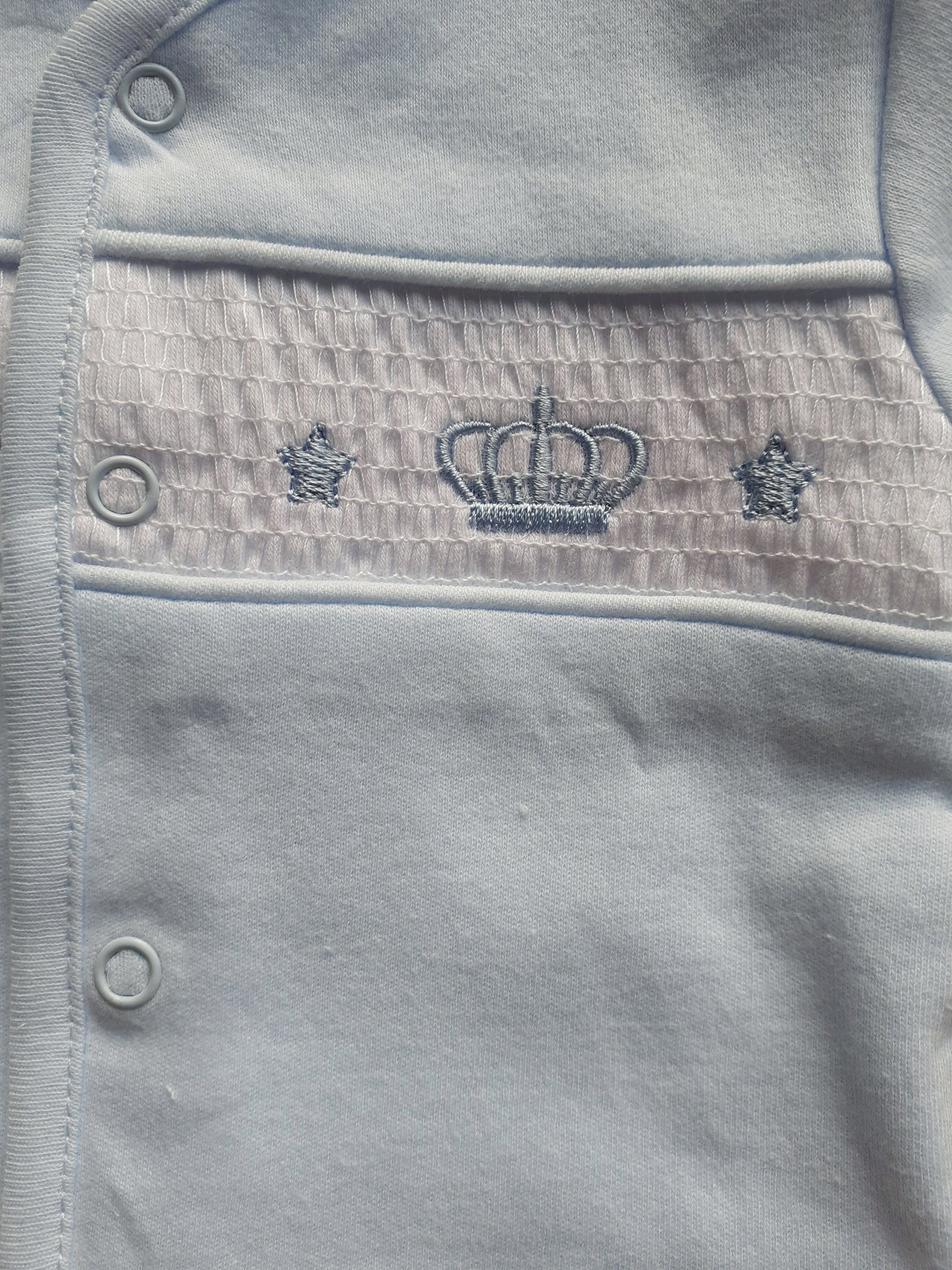 Blue smocked baby jacket with Crown design