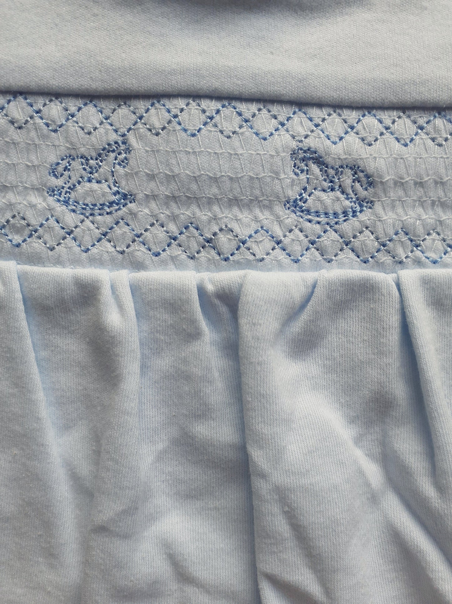 Blue rocking horse embroidery