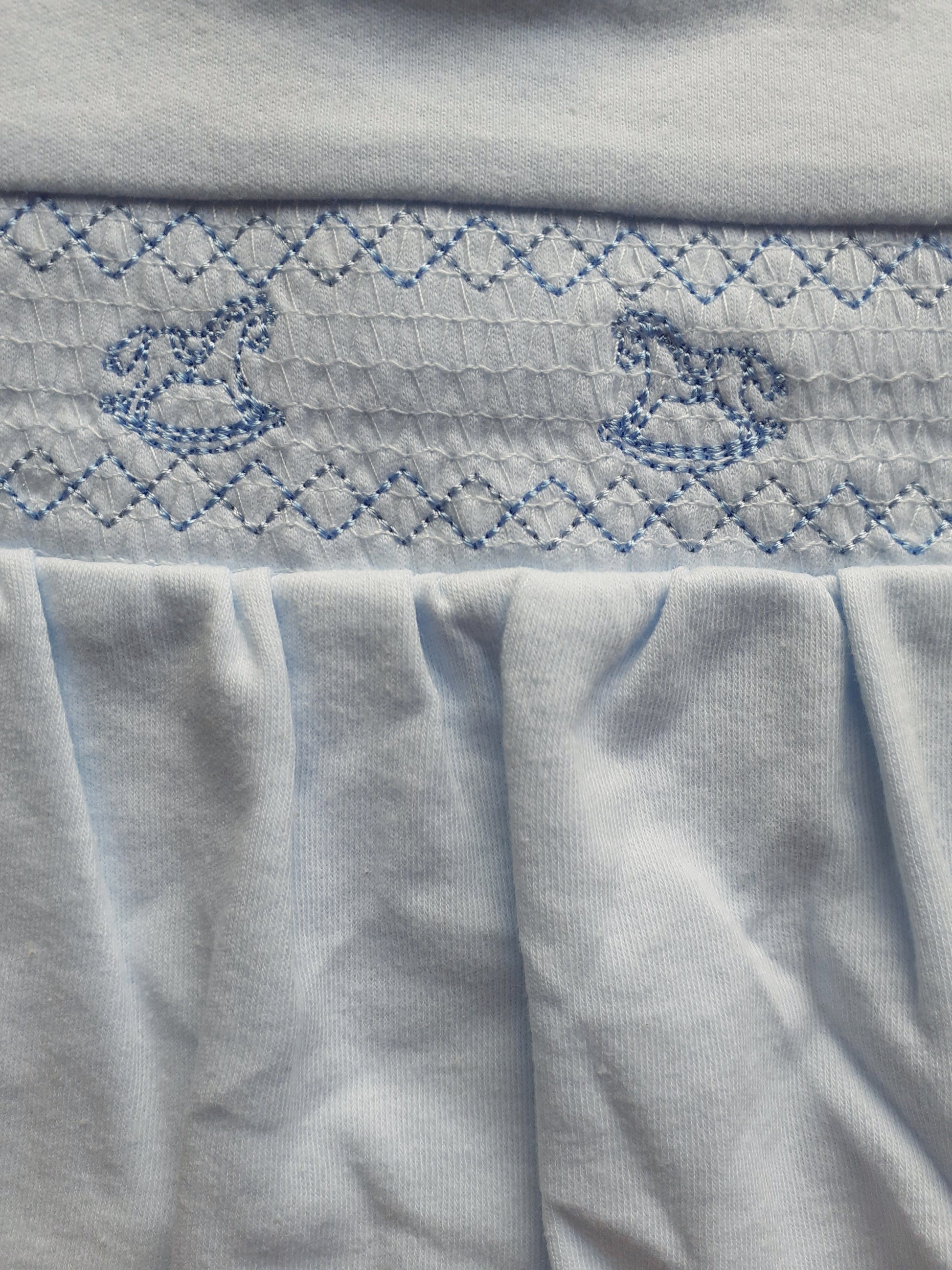 Blue rocking horse embroidery