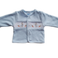 Blue baby jacket smocked with Bunny design