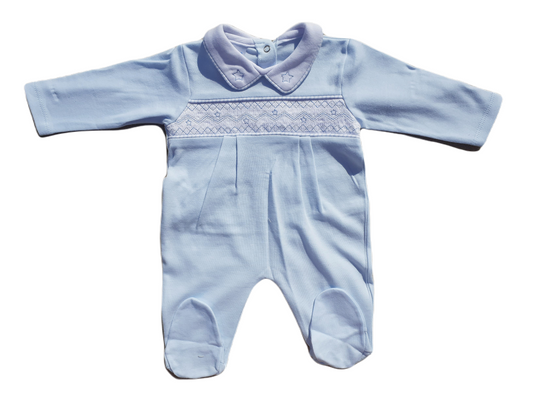 A blue smocked babygrow with star motifs and a snap closure at the top.
