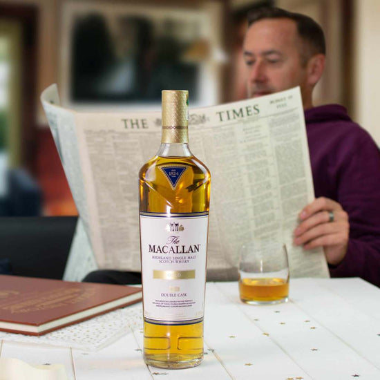 Macallan double cask gold whisky and newspaper 