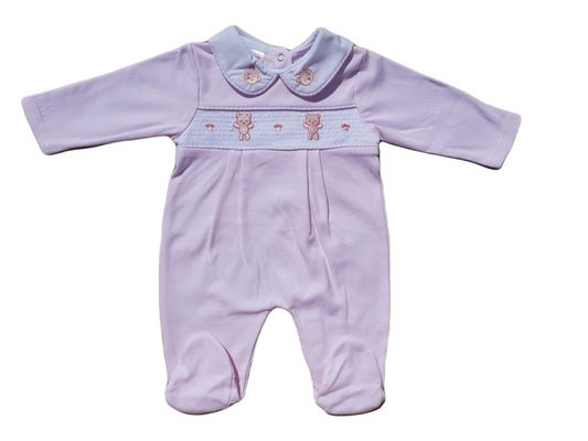 A pink smocked babygrow with a bear and paw motif, featuring a snap button closure.