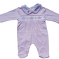 A pink smocked babygrow with a pink crown and hearts motif, featuring a snap-button closure.