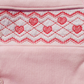 pink smocked heart design