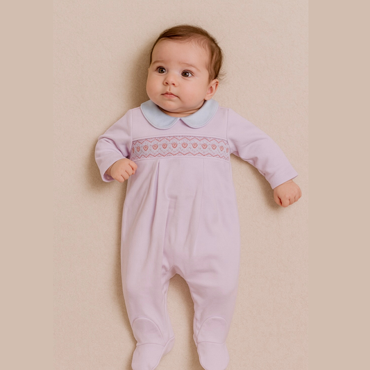 cute baby wearing Pink hearts babygrow