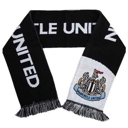 Black reversible jacquard knit scarf with a blck and white fringe