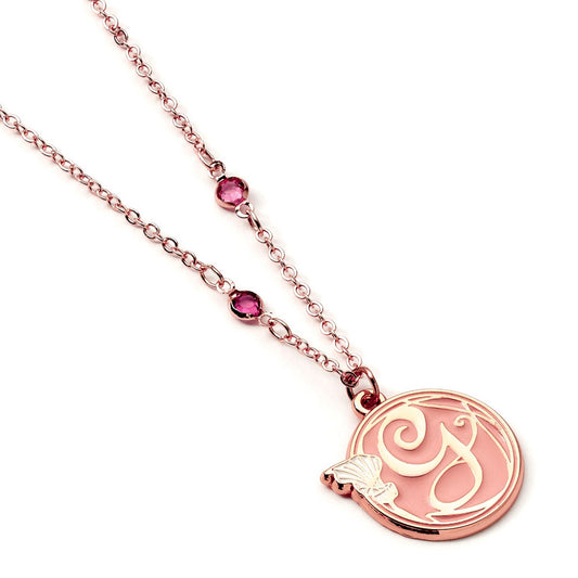 Glindas initial on a peach background