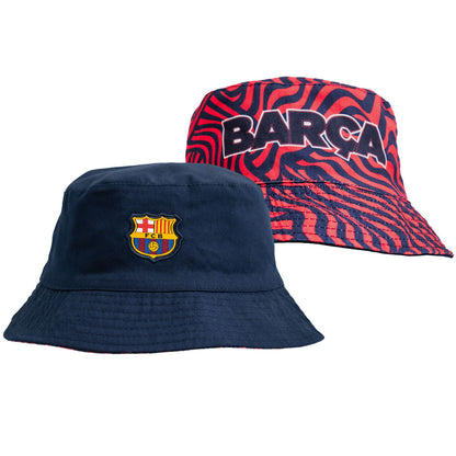 Fitted reversible bucket hat in navy with a red and navy pattern on reverse