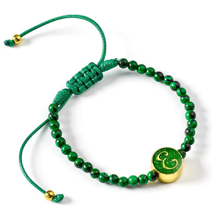 A green bead Friendship Bracelet with Elphaba's initial charm