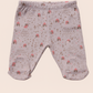 Baby leggings with a pattern on a beige background