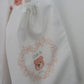 White drawstring bag printed with pink hello bear motif and baby details  By Sweetlea Gifts