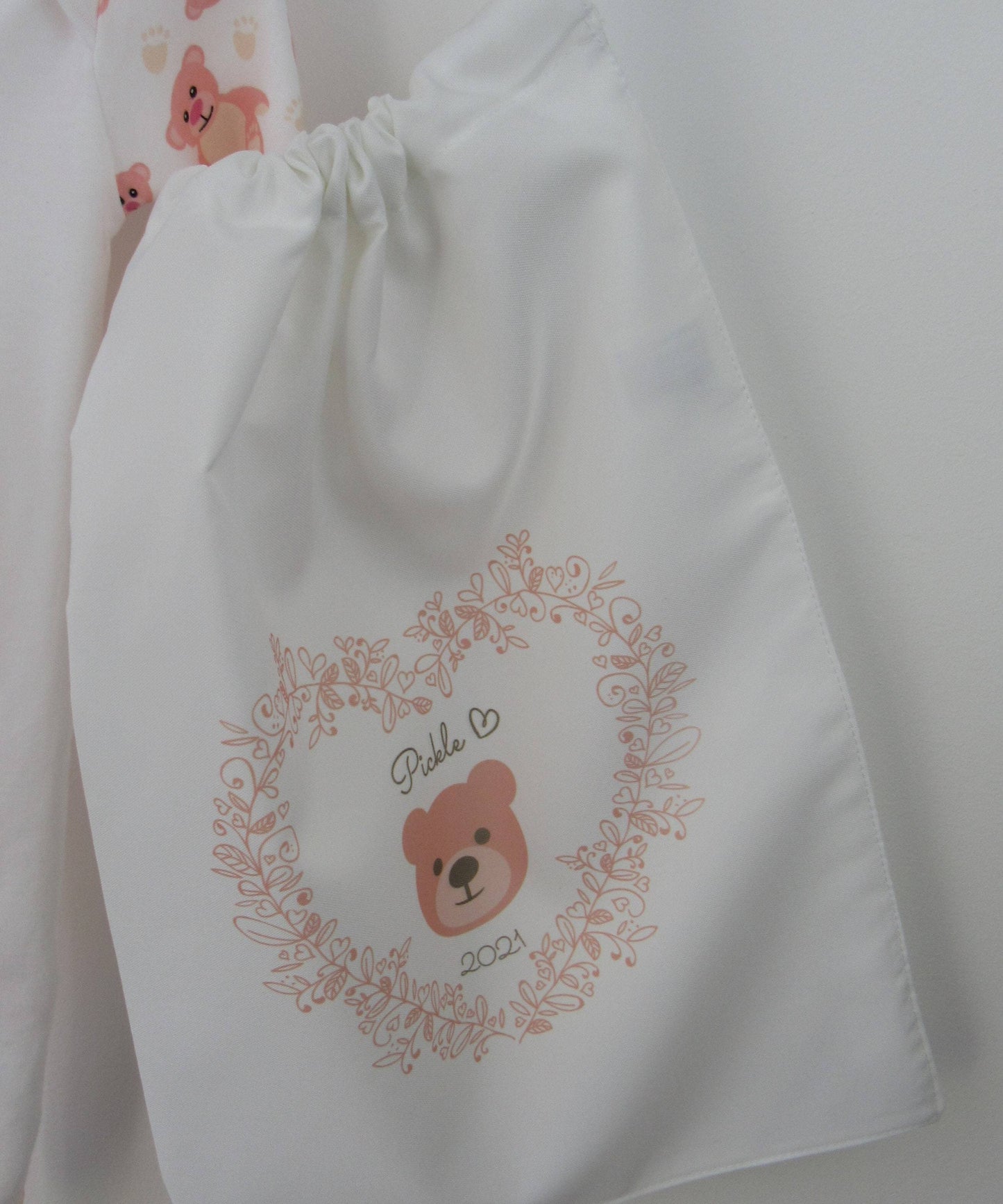 White drawstring bag printed with pink hello bear motif and baby details  By Sweetlea Gifts