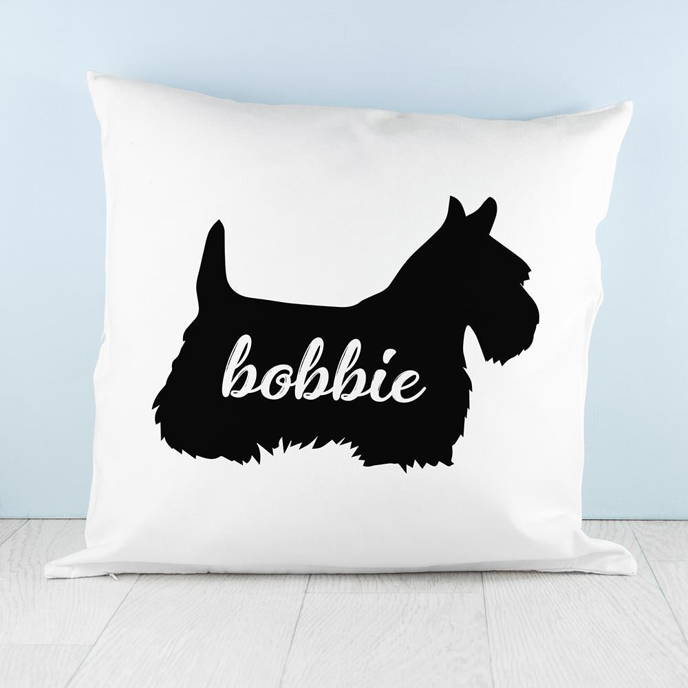 White cushion with Black silhouette of Scottish Terrier Dog personalised with name photographed on white wood floor and pale blue background By Sweetlea Gifts